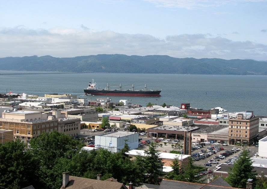 Astoria, Oregon, Daily Photo Downtown Astoria with passing ship
