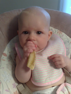 Baby eating Banana
