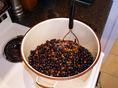 We use a potato masher to encourage the grapes to split.