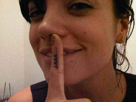 Also, she has the word "Shhh" tattooed on her index finger. Also, she has the word "Shhh" tattooed on her index finger.