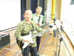 Mr Woon and Mr Quek about to present a song