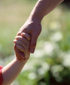 Who is holding who's hand here?