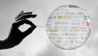 a female hand with a needle about to burst a bubble
