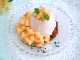 Pannacotta on a round of chocolate sponge cake