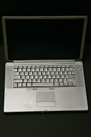 a silver laptop with a black screen