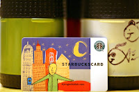 a close-up of a starbucks card