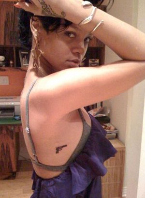 rihanna tattoos gun. Rihanna Tattoos On Finger.