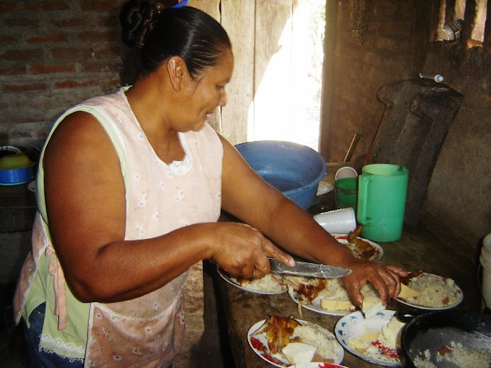 Reyna's mother, preparing lunch