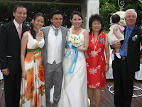 The wedding couple with their family members