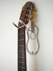 Suporte de violão, guitarra,baixo,  especial com desenho" cromado ou preto.