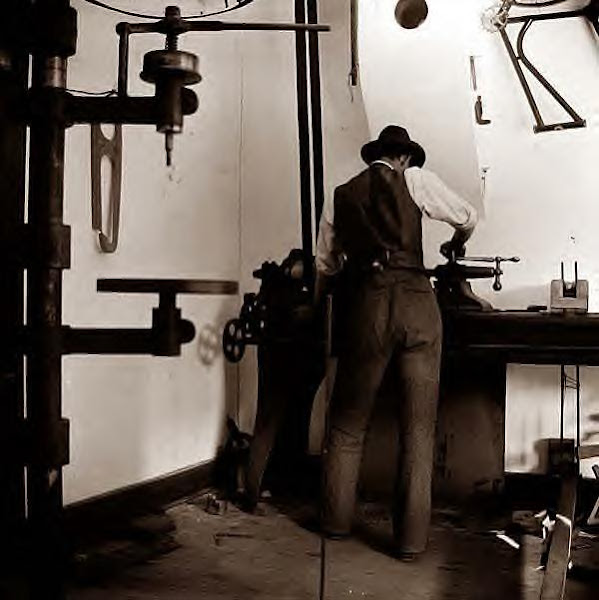 Wilbur Wright working in bicycle shop 1897