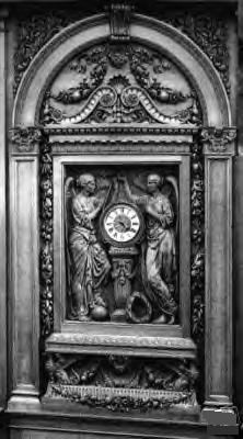 Hand Carved Mahogany Clock at the Grand Staircase
