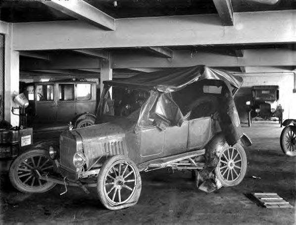 wrecked automobile in a bodyshop. Asheville, NC 1929