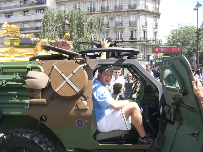 Me in humvee on Bastille day. Tanks everywhere along the streets.
