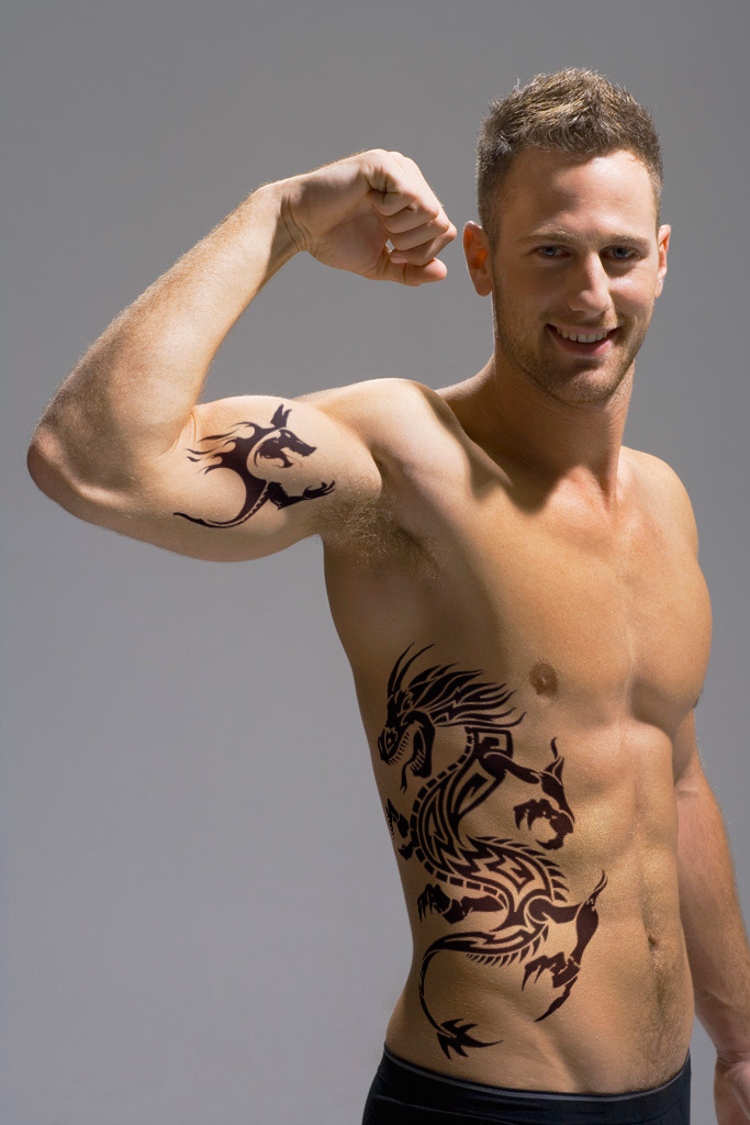 tribal back tattoos for men. inside arm tattoo. tribal