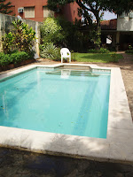 Pool in midday, facing main house