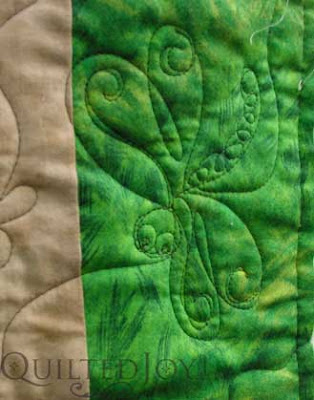 Close up of free-handed dragonfly, featured on a novelty "bug and frog" quilt for a lucky grandson.