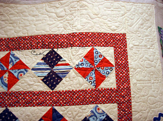 Baby Sailor quilt with custom quilting by Angela Huffman - QuiltedJoy.com