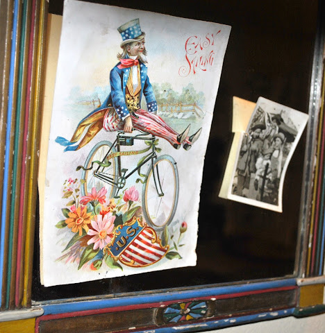 A whimsical Uncle Sam on a bicycle