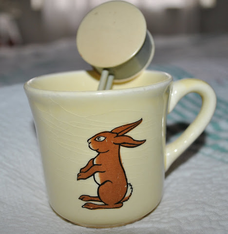 A bunny cup with a vintage rattle