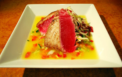 Seared Ahi Tuna with a Radicchio and Green Apple Salad dressed with a Chinese Black Vinaigrette in a Yellow Watermelon Gazpacho with Cucumbers, Bell Peppers, and Jalapenos (Photo by Justin Geddes)