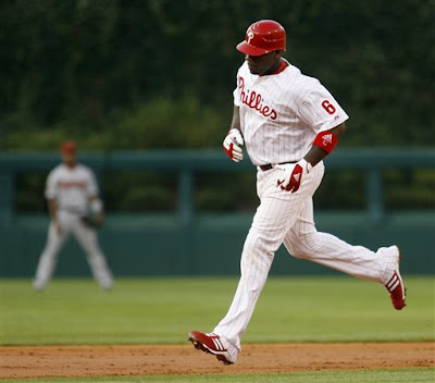 Ryan Howard rounding second after hitting his major-league-leading 28th home run