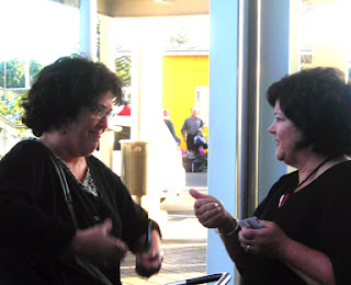 two short women in the airport