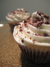 vanilla buttercream & cocoa nibs on chocolate cupcakes