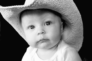 Fort Worth baby picture of baby wearing cowboy hat