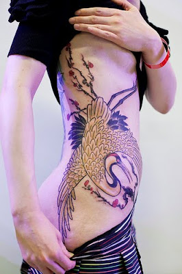 peacock side tattoo