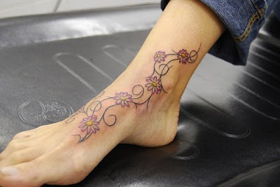 vines tattoos,daisy tattoo,tattoos on foot,foot tattoos