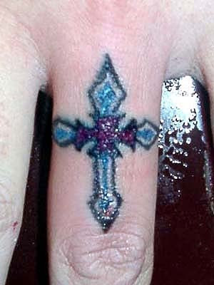 blue tattoo cross on ring fingers