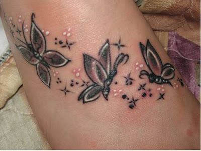 simple butterfly tattoo. tattoos for womens feet.