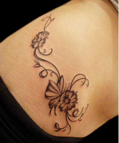 tattoos of flowers on hip. flower tattoo on the hip