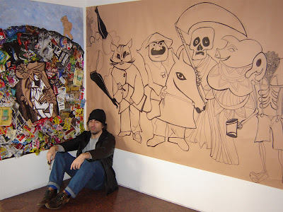 Rep frente a uno de sus murales