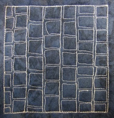From http://freemotionquilting.blogspot.com/2010/05/day-180-slate-tile.html