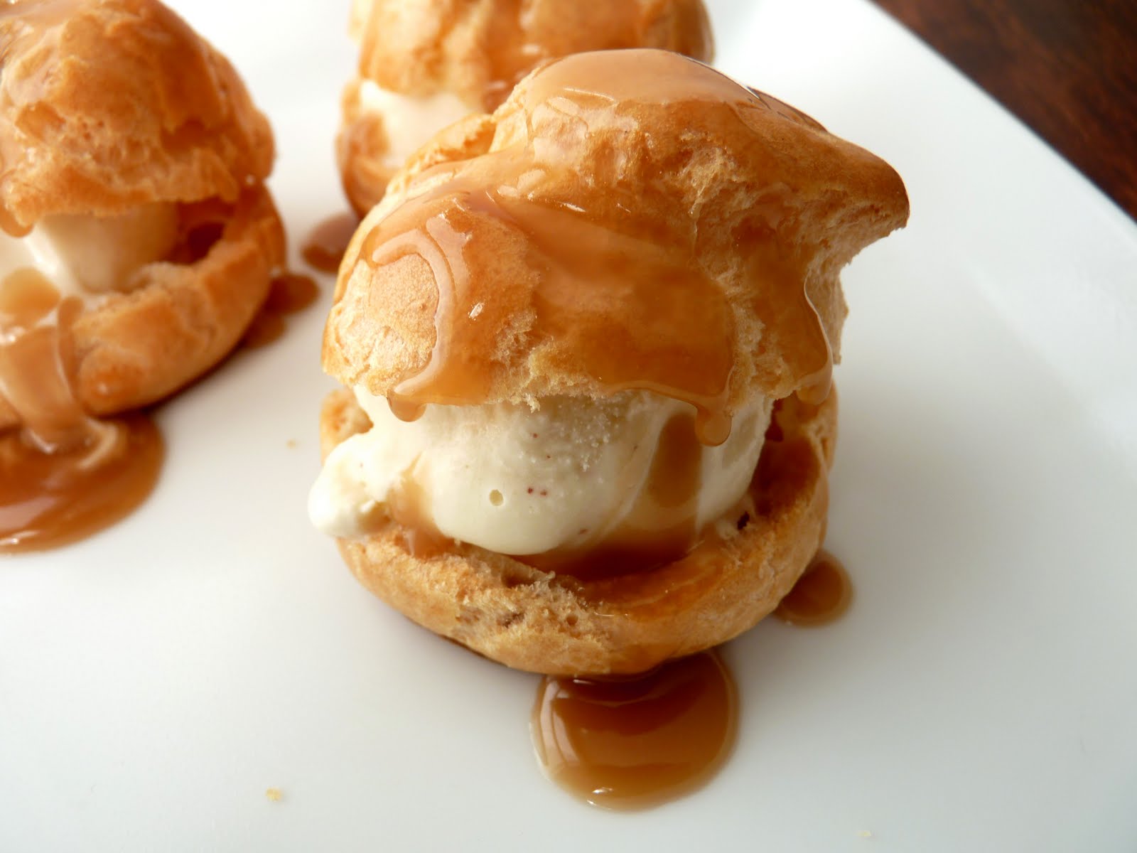 pastry studio Profiteroles with Eggnog Ice Cream and Rum Sauce