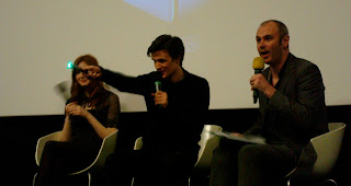 Matt Smith demonstrating his Sonic Screwdriver - note it's green not blue! - on stage with Karen Gillan (Amy Pond) and interviewer Joe Lindsay