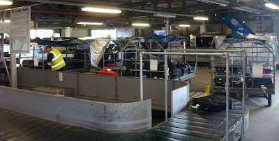 Putting bags onto trailers, labelled with bingo cards