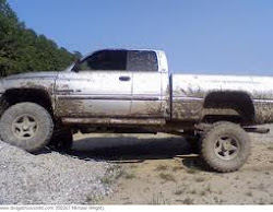 Muddy Dodge On Gravel Pile