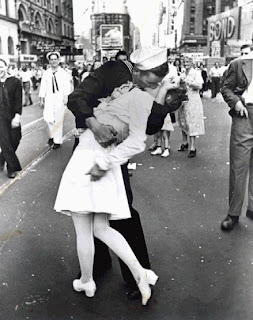 Tall boy kissing short girl