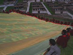 rolling up giant thangka