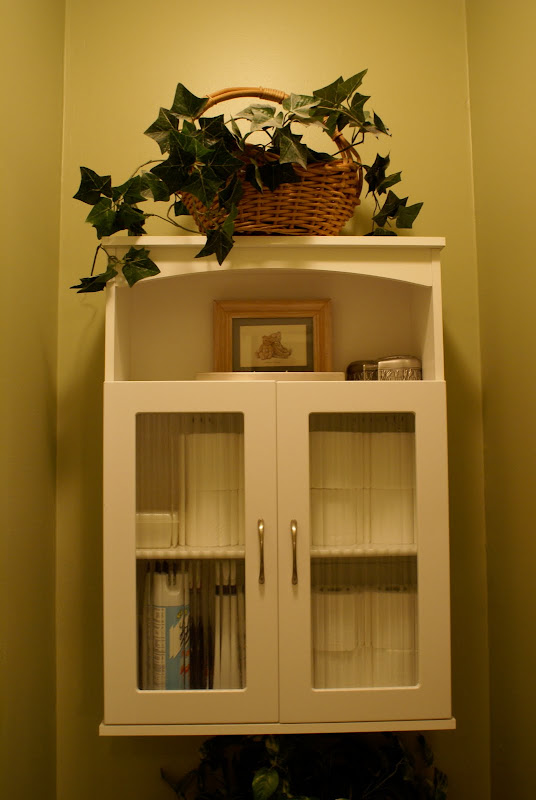 and painted it white to match the rest of the cabinetry in the bath title=