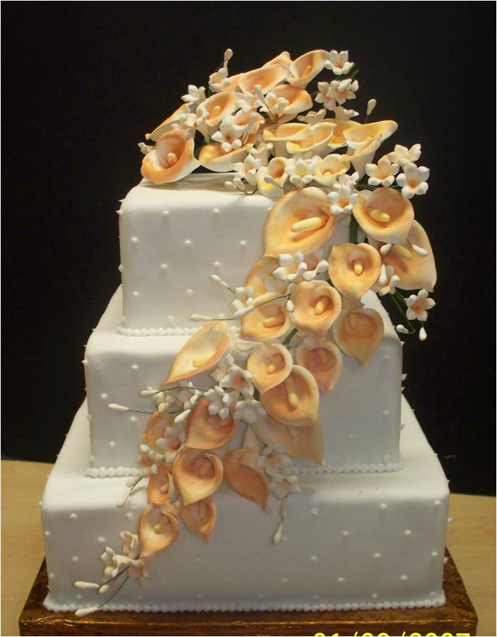 The wedding cake will look astonishing with some colorful calla lilies on it The wedding cake will look astonishing with some colorful calla lilies on it