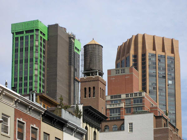 Loud Midtown Ensemble - A water tank punctuates green and orange brutes around 34th St. & Park Ave. South.