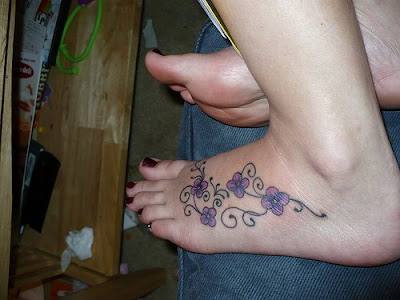 tattoos on foot with names. flower tattoos on foot