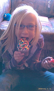 Birthday girl and a huge cupcake