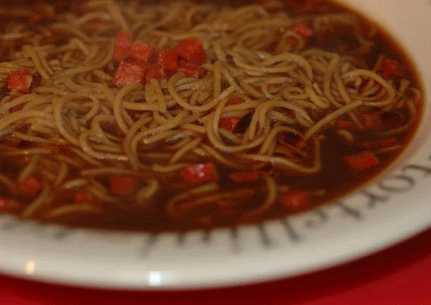 Chorizo and egg noodles in a game stock soup with chilli-infused oil Chorizo and egg noodles in a game stock soup with chilli-infused oil