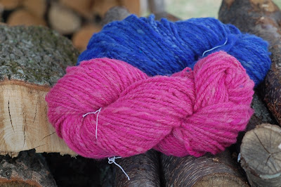 Blue and pink handspun yarn on the woodpile