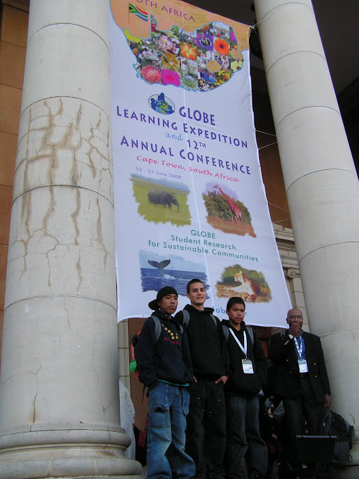 Kids in front of GLE Banner